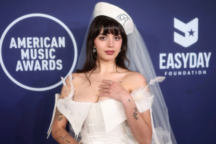 Rebecca dresses for a shotgun wedding at the AMAs in Vegas