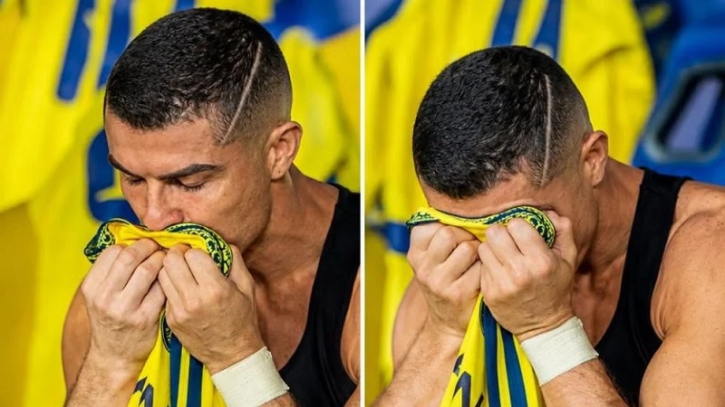 Ronaldo kisses the Saudi Arabian flag