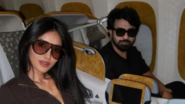 Shakib and Mithila sat side by side on the plane