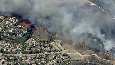 Evacuation orders issued as wildfire burns in Orange County